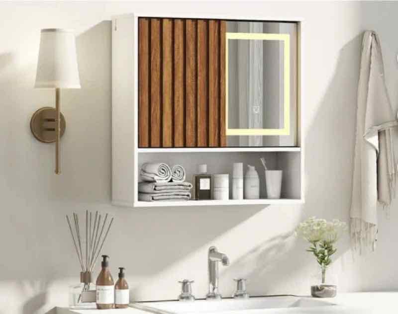 Wall-mounted bathroom cabinet with LED mirror and sliding fluted door