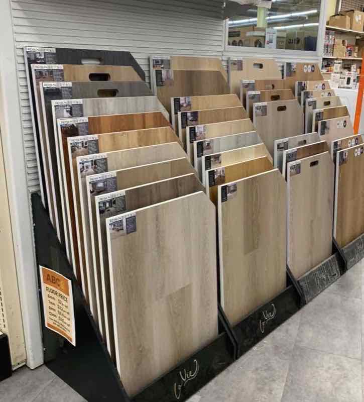 Vinyl plank flooring samples on display rack