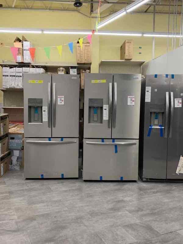 Three stainless steel French-door refrigerators side by side